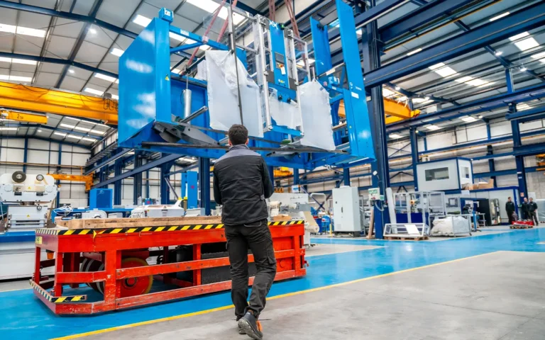 worker-using-a-crane-to-lift-very-heavy-machinery